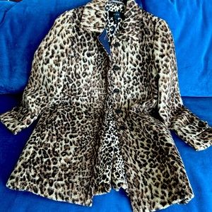 J Crew leopard print coat with interior polyester and placket lining .